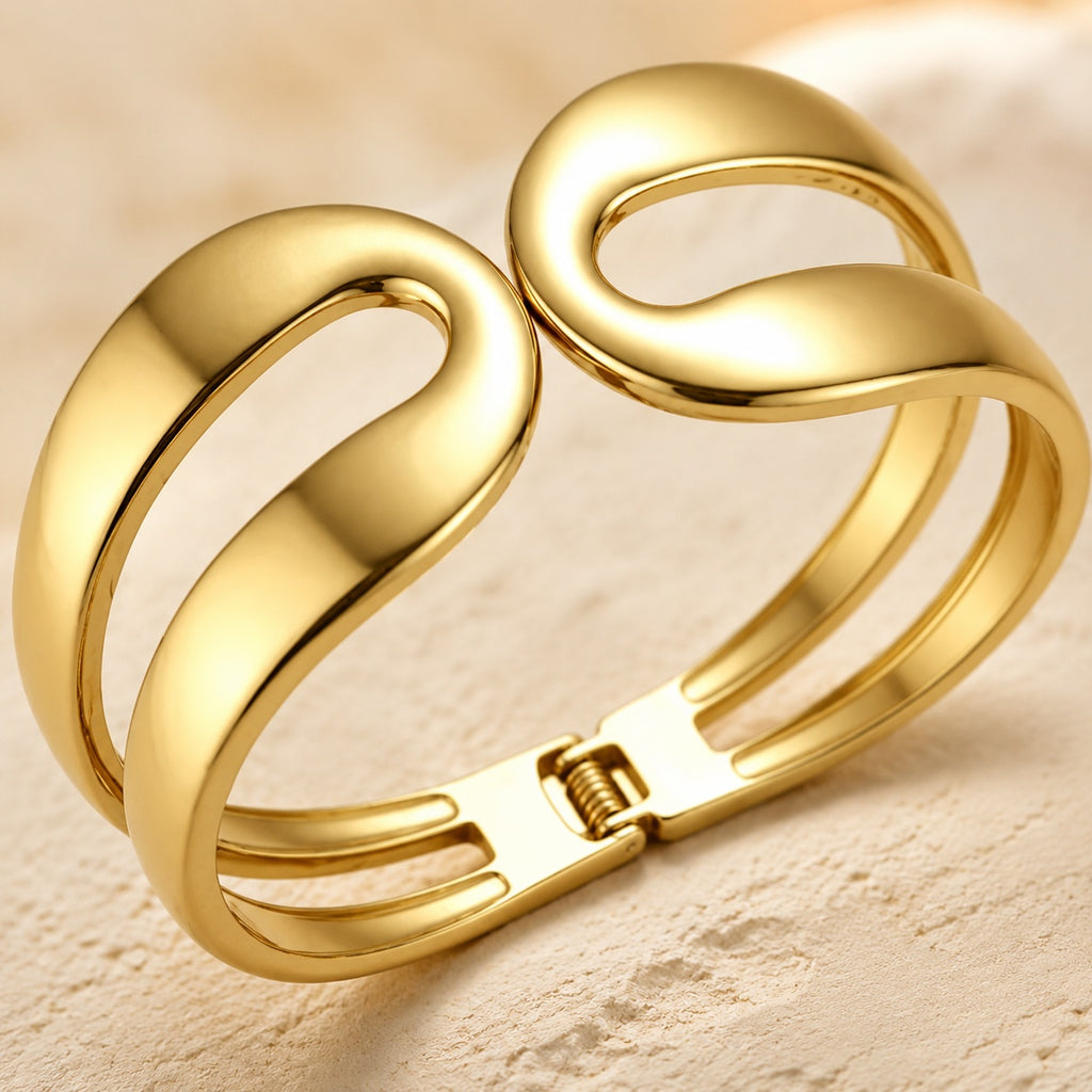 Élan Sculptural Cuff Bracelet – Gold Open-Swirl Statement Bracelet